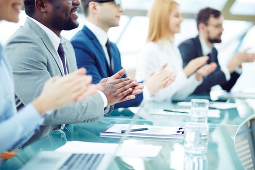 Business people applauding at seminar