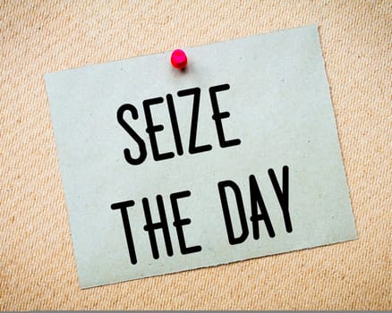 Recycled paper note pinned on cork board.Enjoy Life Message.Happiness Concept Image