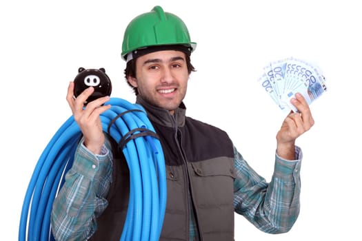 Craftsman with piggy bank and cash