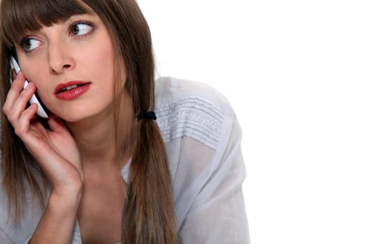 A cute woman over the phone.