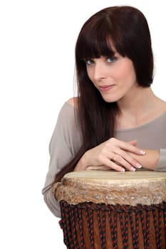 Woman posing with bongo drum