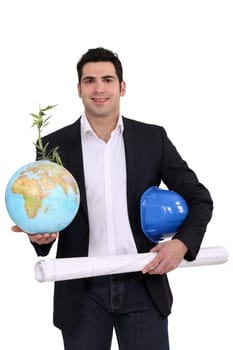 Architect holding globe and plans