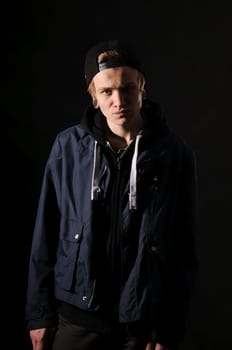handsome young man on black background