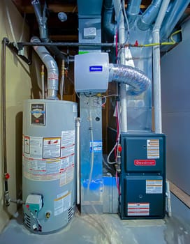 Calgary, Alberta, Canada. Sep 21, 2020. A home Goodman high efficiency furnace with Bradford White Residential gas water heater & an Generalaire humidifier.