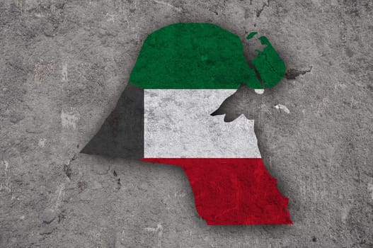 Map and flag of Kuwait on weathered concrete