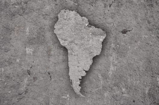 Map of South America on weathered concrete
