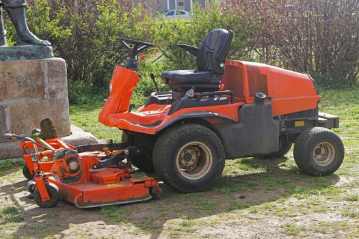 Ride on lawn mower machine in park