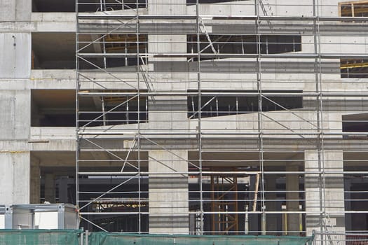 Scaffolding at concrete building construction site