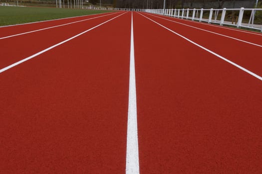 Running track in the small stadium. Rubber coating.