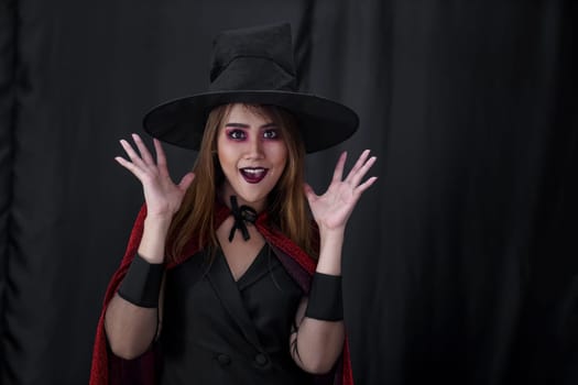 Portrait of asian young adult teenage woman wear Halloween costume cloth for Halloween party carnival. Halloween celebrate and international holiday concept.