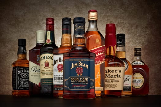 St.Petersburg, Russia - April  2020 - Bottle of Jim Beam bourbon whiskey (double oak twice barreled) on background of other popular brands of whiskey (whisky) on dark  background