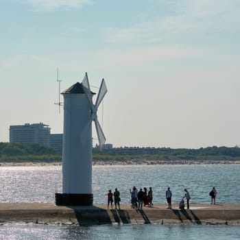The windmill fire on the shore of the Baltic Sea coast, the symbol of the town of Swinoujscie