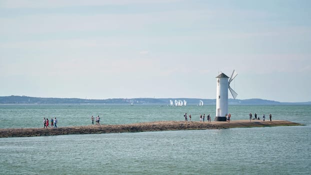 The windmill fire on the shore of the Baltic Sea coast, the symbol of the town of Swinoujscie