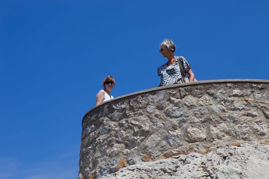 MAIORCA, SPAIN - MARCH 13: two women at the Cabo Formentor, on March 13, 2016 in Palma de Maiorca, Maiorca Island, Spain