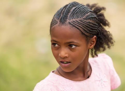 Adi Abbaghie, Ethiopia - April 28, 2019: Ethiopian beautiful girl with traditional braided hair style in Adi Abbaghie, Ethiopia, Africa