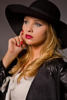 fashion young woman on a dark background