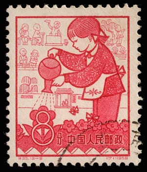 Stamp issued in the China shows Nursery, the 1st Anniversary of People's Communes, circa 1959.