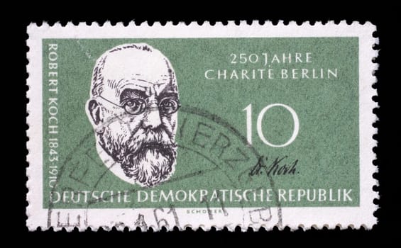 Stamp issued in Germany - Democratic Republic (DDR) shows Prof. Dr. Robert Koch, bacteriologist, 125th annivers. of the Humboldt university, 250th annivers. of the Charité, circa 1960.
