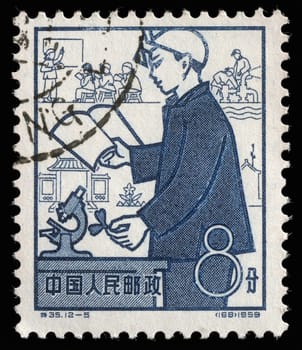 Stamp issued in the China shows Education, the 1st Anniversary of People's Communes, circa 1959.