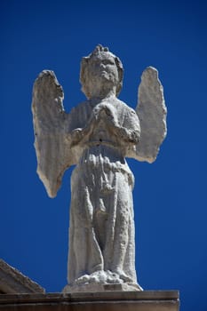 Angel, statue on the portal of Church of the Assumption of the Virgin in Pag, Croatia