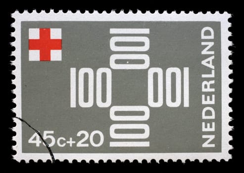 Stamp printed in Netherlands shows The numbers "100"" forming a cross, Red Cross series, circa 1967"