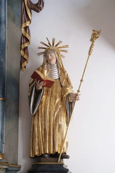 Saint Scholastica, altar statue in the church of St. Agatha in Schmerlenbach, Germany