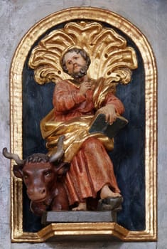 Saint Luke the Evangelist, pulpit statue in the church of St. Agatha in Schmerlenbach, Germany