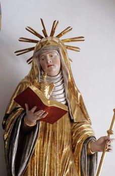 Saint Scholastica, altar statue in the church of St. Agatha in Schmerlenbach, Germany