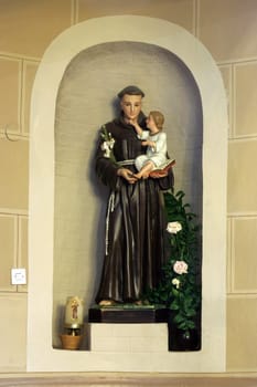Saint Anthony of Padua holding child Jesus, statue in the church of the Saint Peter in Ivanic Grad, Croatia