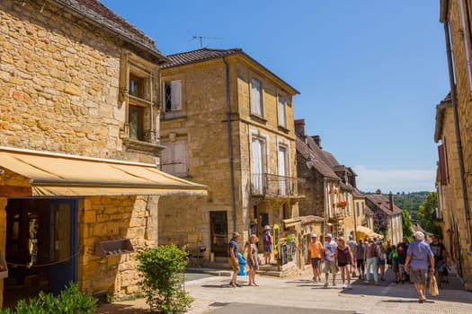 Domme, France - August 14, 2019:Tourists visiting the medieval town of Domme in the Dordogne France