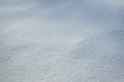 Fresh snow with morning sun light as background