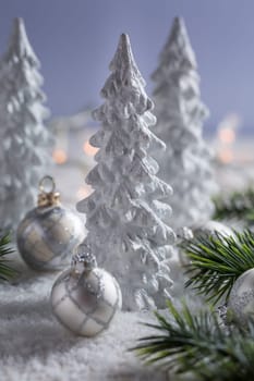White trees with small Christmas balls as snowy landscape. Christmas decoration.