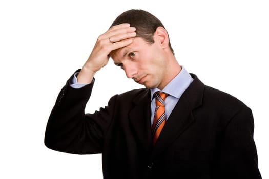 Businessman in a suit gestures with a headache