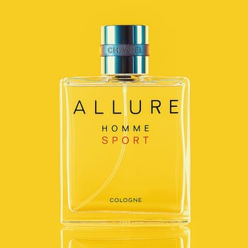 A bottle of Chanel perfume on a uniform yellow background, with a reflection of the lower part. Allure men's perfume series. Layout, layout, advertising, mockup. 2020-07-05 Samara.