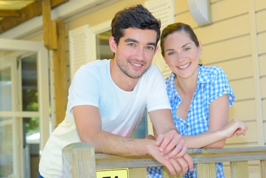 Portrait of couple on terrace of mobile home