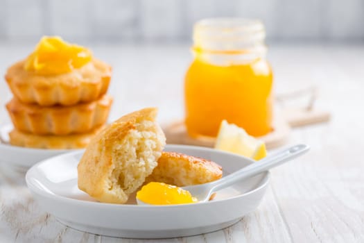 Homemade lemon curd tarts on kitchen table