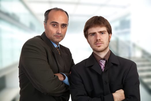 two young pensive business men portrait standing