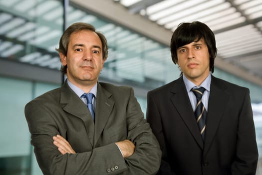 two young business men portrait, focus on the right man