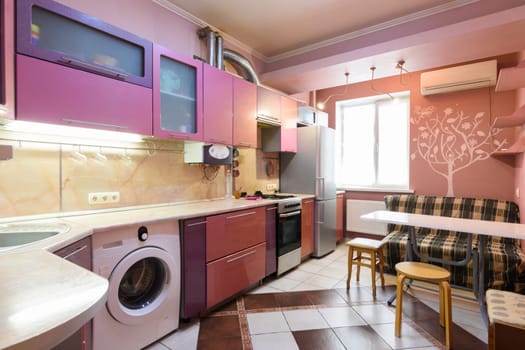 Interior of a modern kitchen in an apartment of a multi-storey building