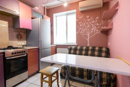 Kitchen table and sofa in the interior of the kitchen