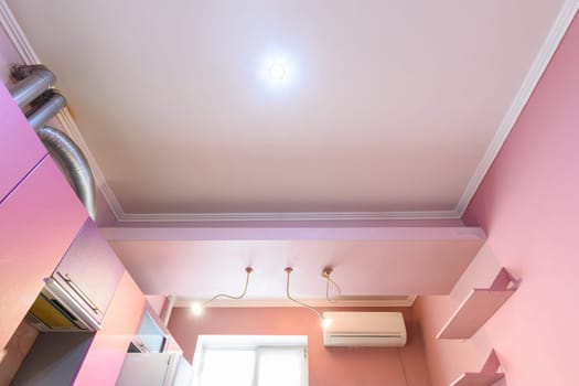 Multi-level plasterboard ceiling in the interior of the kitchen