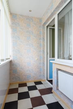 Anapa, Russia - March 3, 2020: Small glazed balcony in an apartment of a multi-storey building