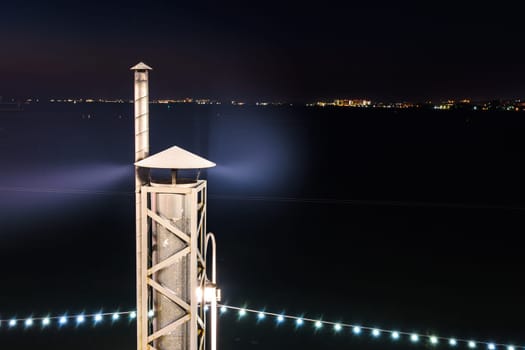 Smoke coming from the chimney, long exposure at night