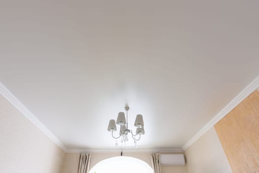 Classic white matte ceiling in the hall