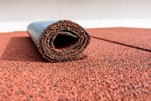 On the roof covered with roll tiles, there is a residue in a roll