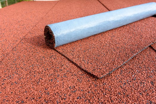 The roof is finished with red bituminous tiles