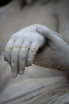 Mary holds Jesus's broken hand in a Victorian cemetery pieta, beautiful tenderness in natural light with copy space