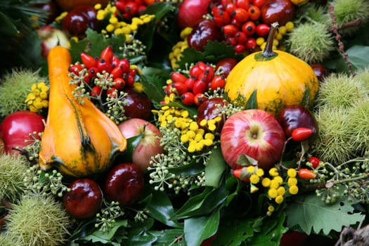 Fall arrangement with fruits and flowers