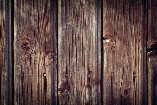 Old wooden planks on gates of an abandoned building