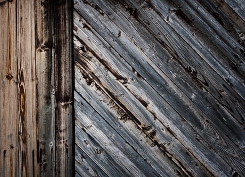 Old wooden planks on gates of an abandoned building